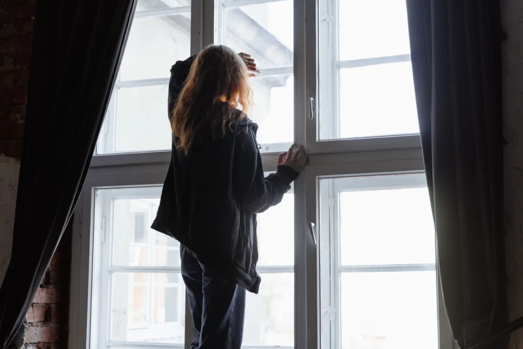 Person reflecting during their GLP-1 weight loss journey.